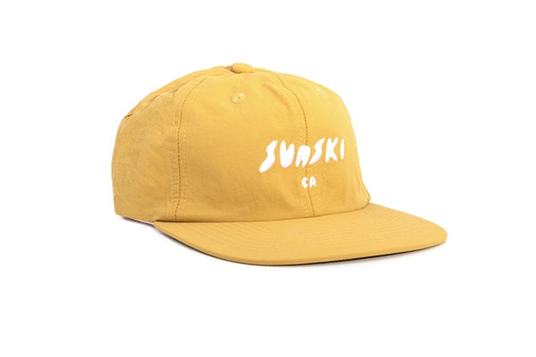 sunski team hat yellow three quarter angle