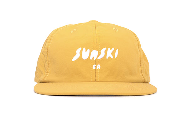 sunski team hat yellow front angle