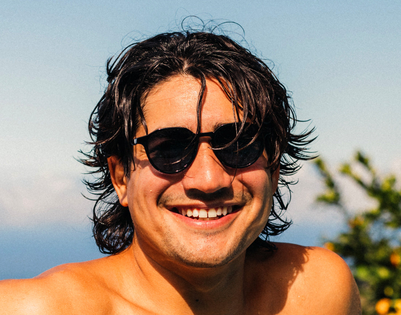 guy wearing sunski vallarta sunglasses smiling