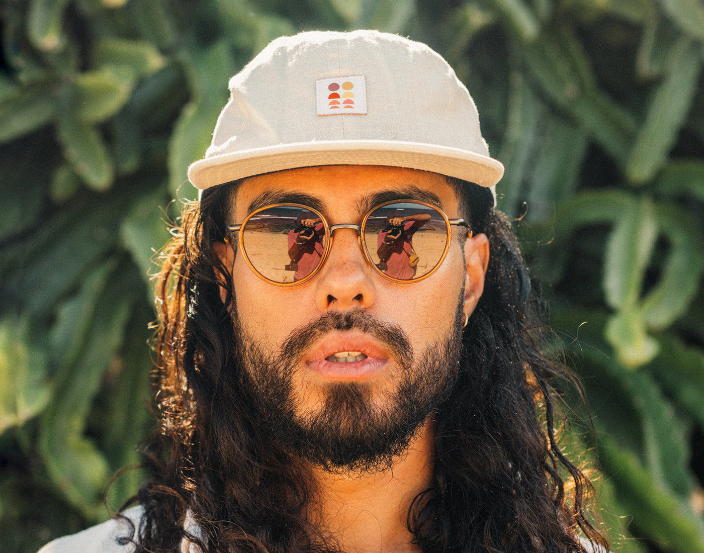 man looking directly at camera wearing sunski baia sunglasses