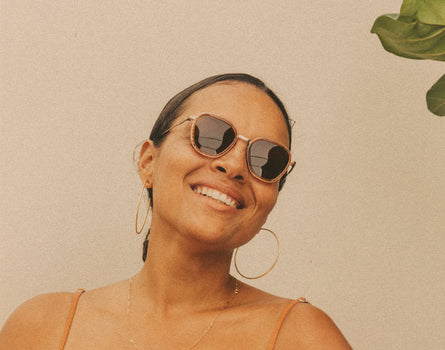 woman smiling wearing sunski bernina sunglasses