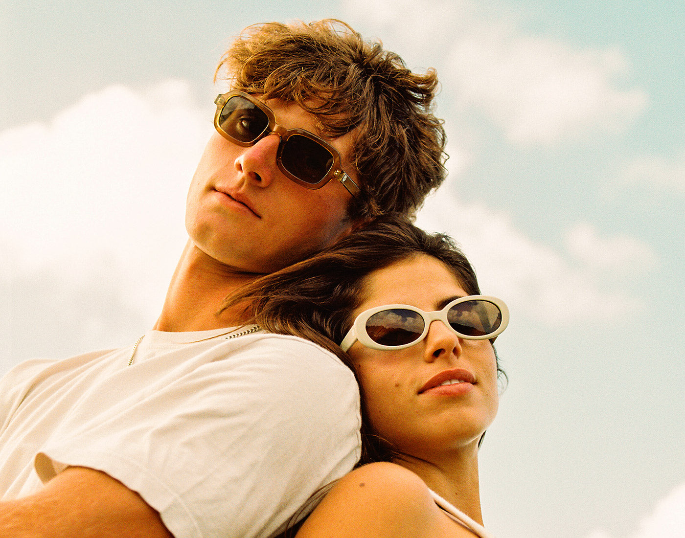 guy and girl wearing sunski bianca sunglasses