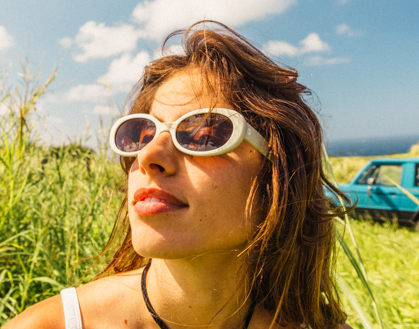 profile of girl wearing sunski bianca sunglasses