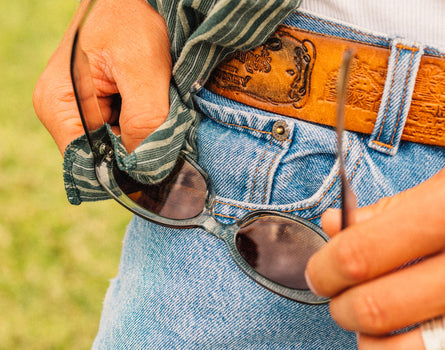 guy cleaning sunski bianca sunglasses