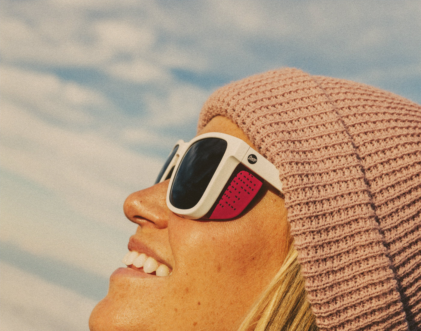 close up profile of girl wearing sunski couloir sunglasses