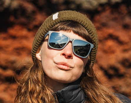 girl wearing beanie and sunski couloir sunglasses