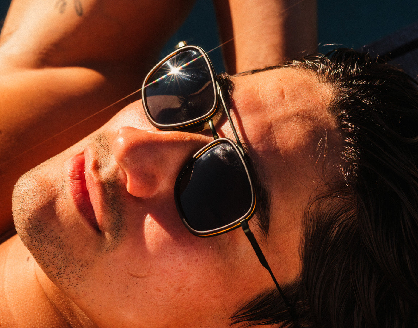 guy basking wearing sunski estero sunglasses