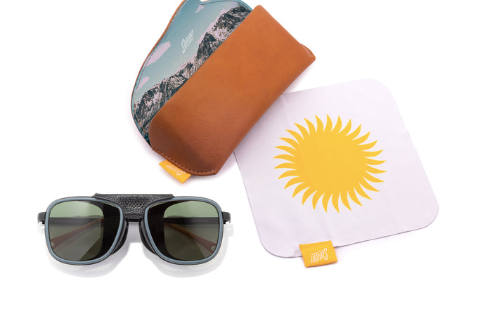 sunski ferrata storm forest laydown with sunglasses and case