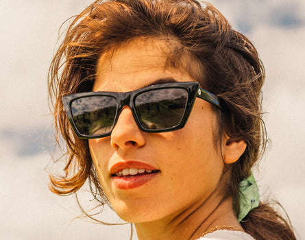 girl looking over her shoulder wearing sunski fiorella sunglasses