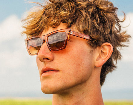 profile shot of guy wearing sunski fiorella sunglasses