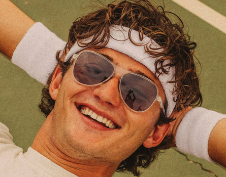 guy with hands behind his head wearing sunski foxtrot sunglasses