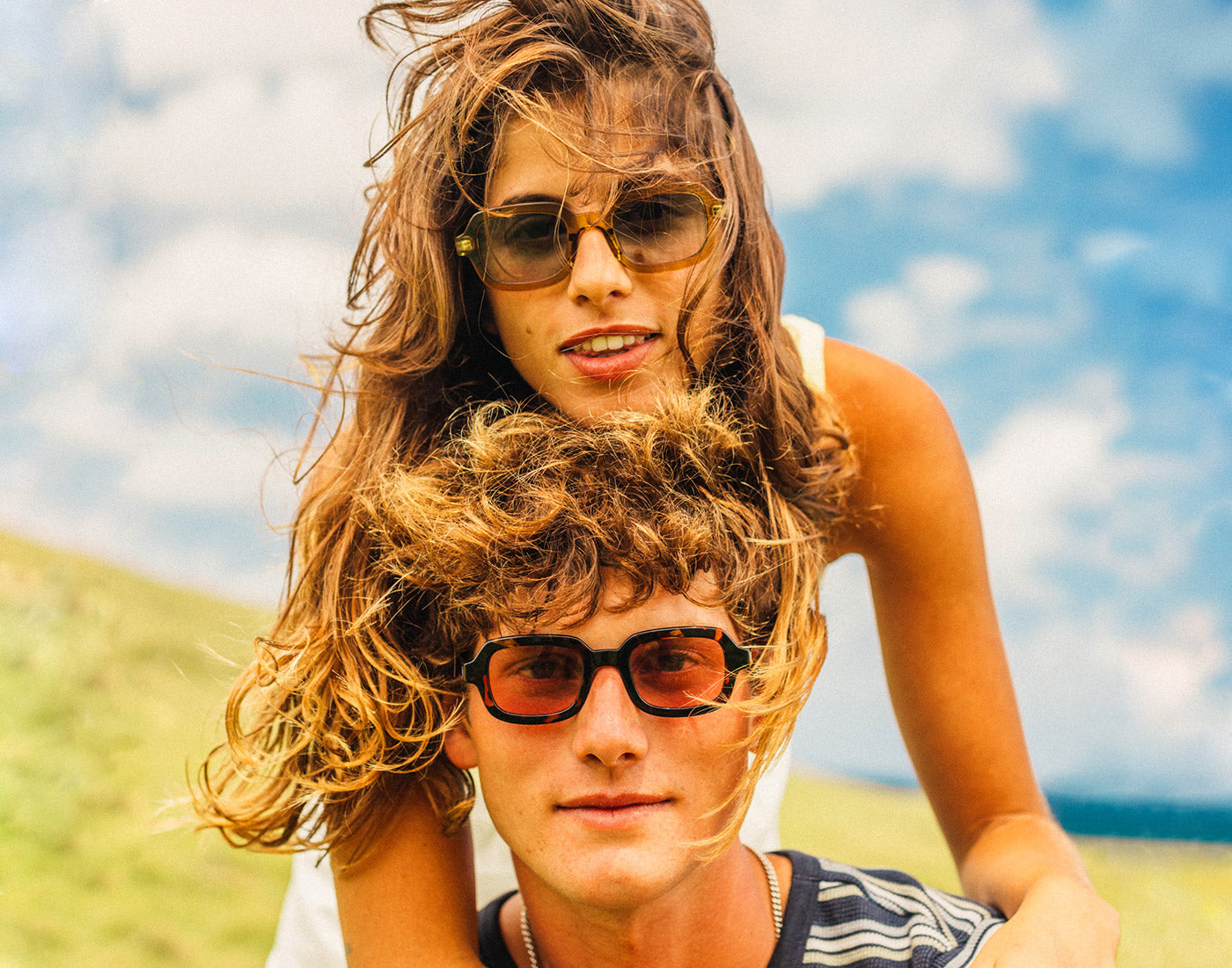 guy and girl wearing sunski lago sunglasses