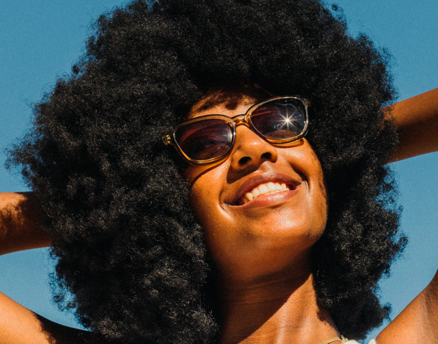 girl basking wearing sunski miho sunglasses