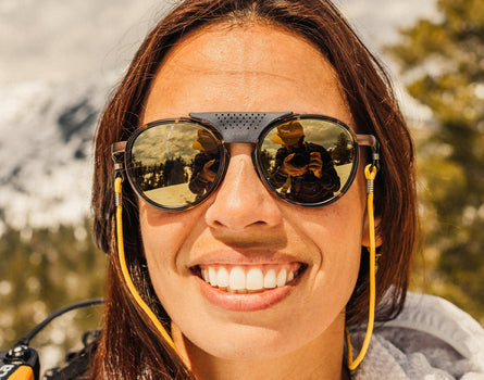 close up of girl smiling wearing sunski strada sunglasses