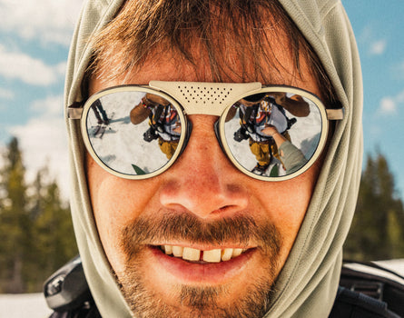 close up of guy smiling wearing sunski sunglasses