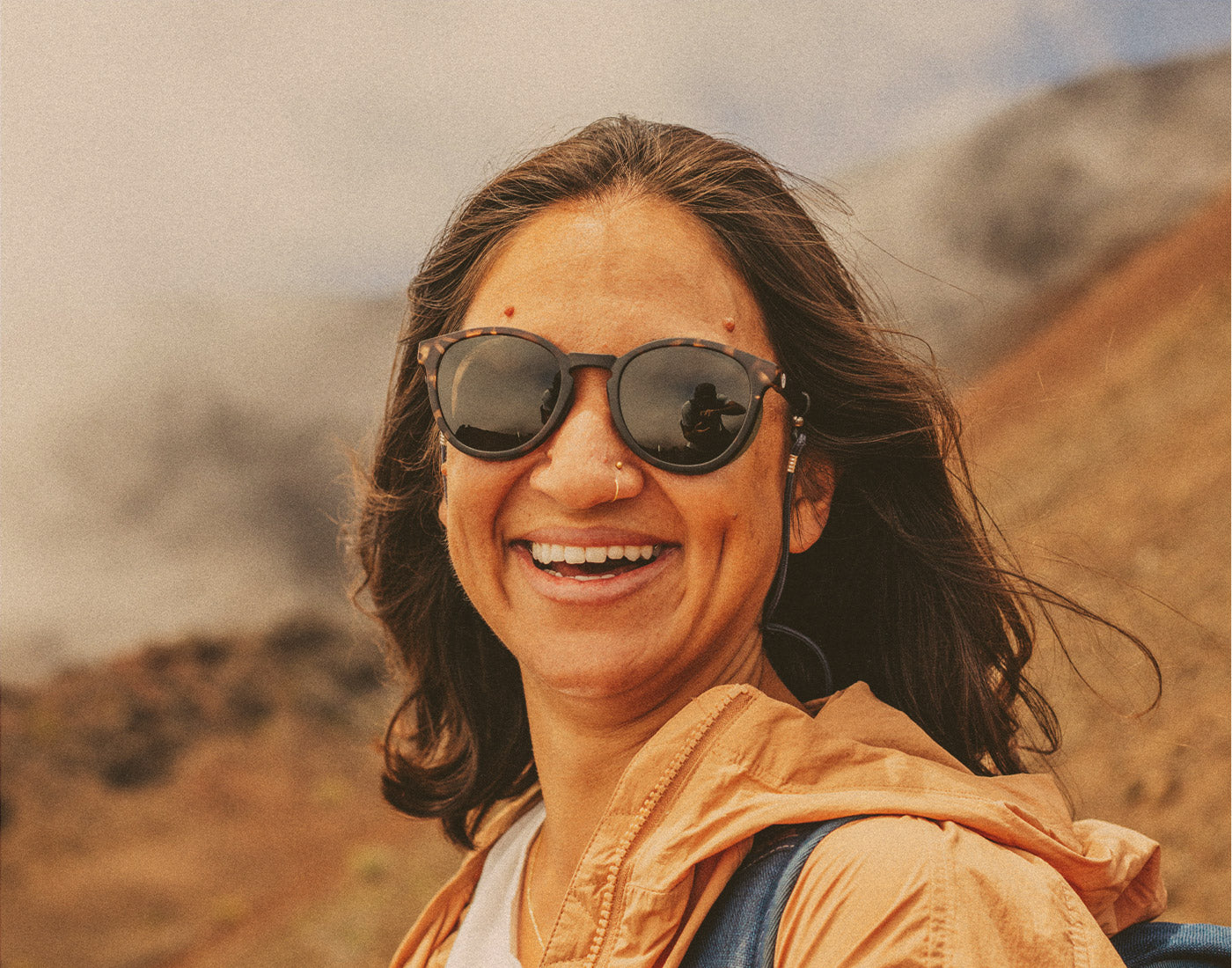 woman laughing wearing sunski tera sunglasses