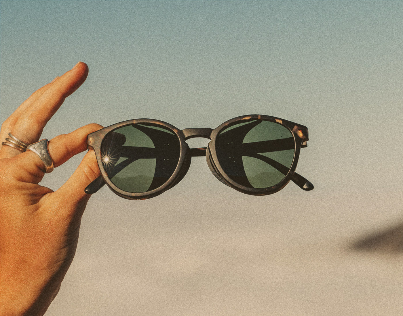 hand holding sunski tera sunglasses 