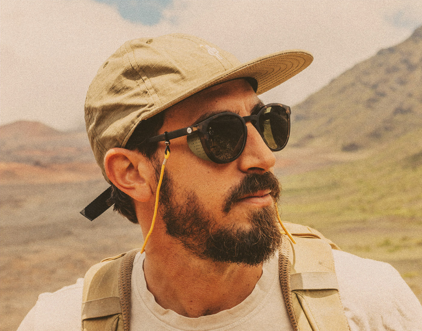 profile of man on a hike wearing sunski tera sunglasses