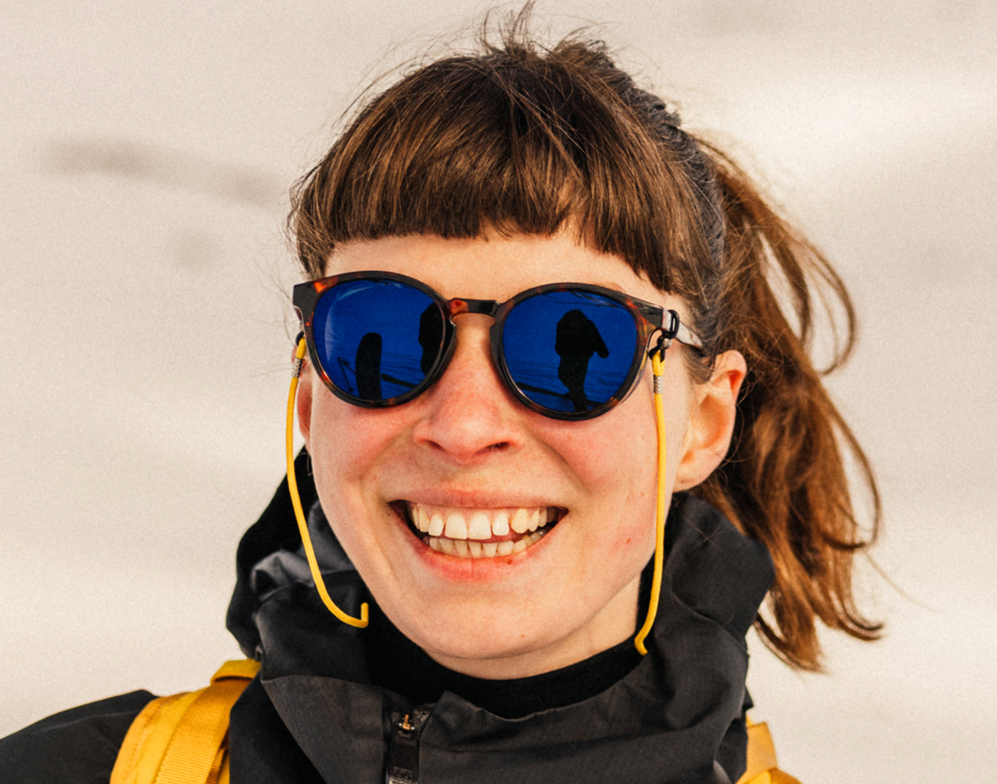 woman laughing wearing sunski tera sunglasses