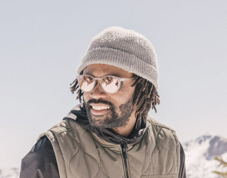 guy in a beanie wearing sunski tera sunglasses