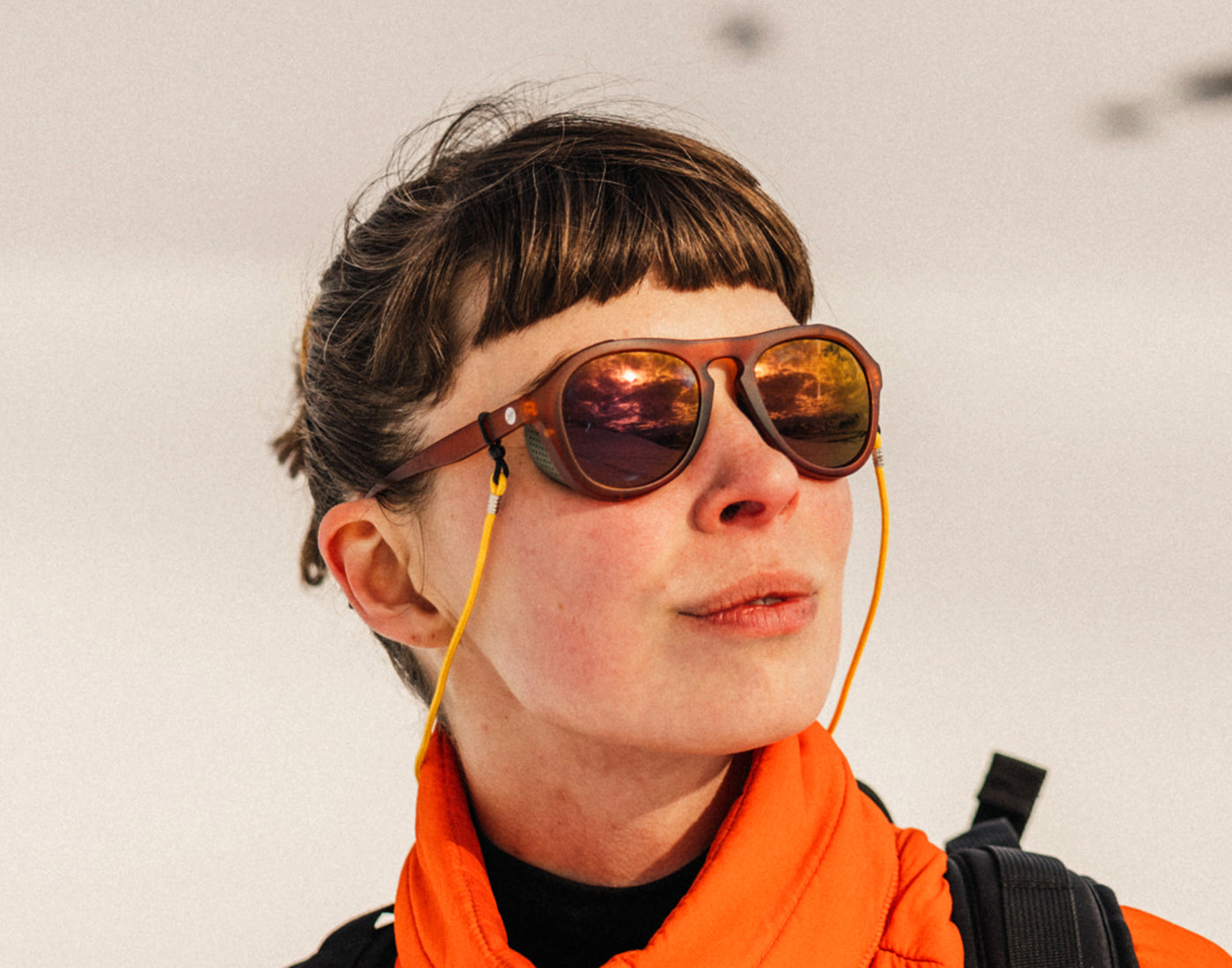 three quarter angle of girl wearing sunski treeline sunglasses