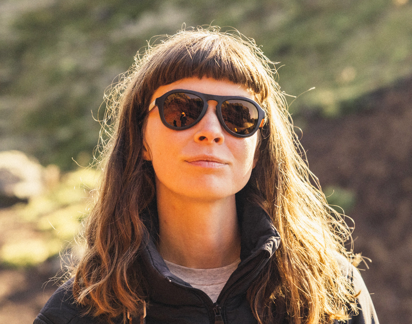 girl with bangs wearing sunski treeline sunglasses