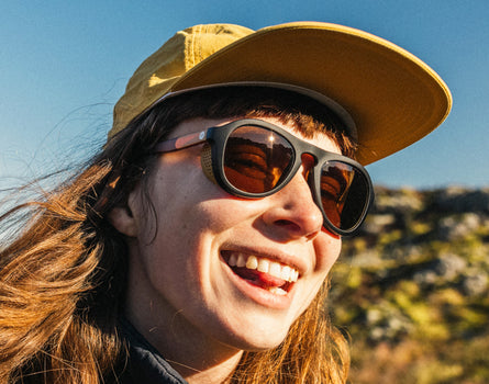 girl in team hat wearing sunski treeline sunglasses