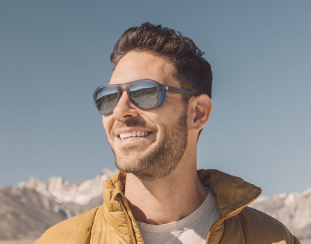man smiling wearing sunski treeline sunglasses