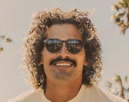 close up of man wearing sunski yuba sunglasses