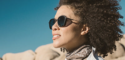 woman wearing premium sunglasses by sunski
