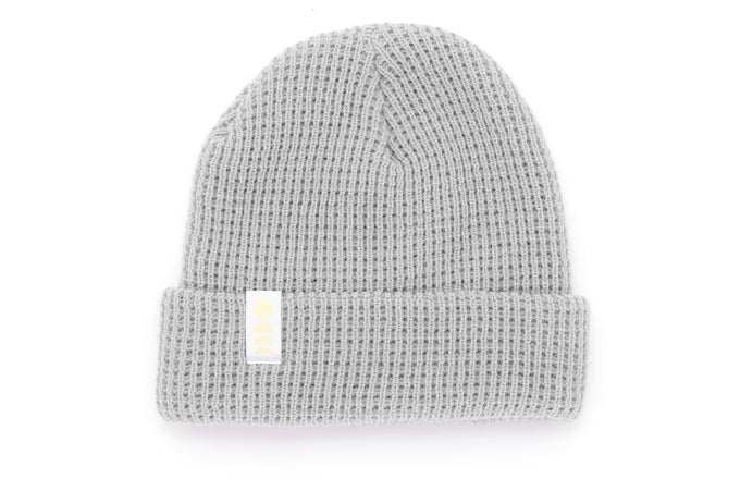 sunski winter sun beanie fog flat lay