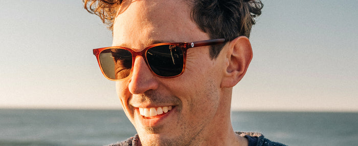 man smiling wearing sunski ventana sunglasses