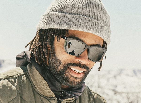 close up of guy wearing sunski couloir sunglasses