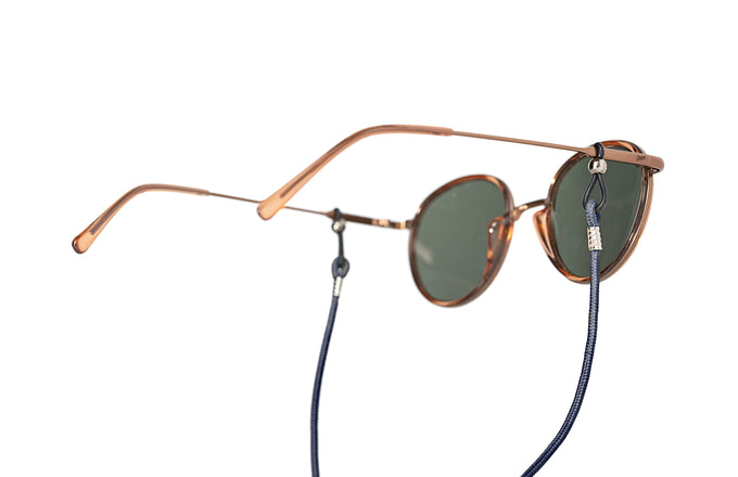 sunski sunglasses retainer navy on a pair of premium sunglasses