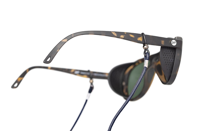 sunski sunglasses retainer navy on a pair of alpine sunglasses