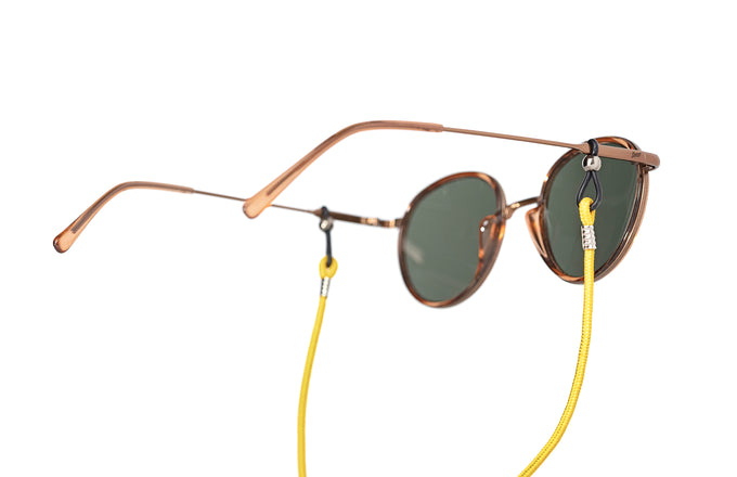 sunski sunglasses retainer yellow on a pair of premium sunglasses