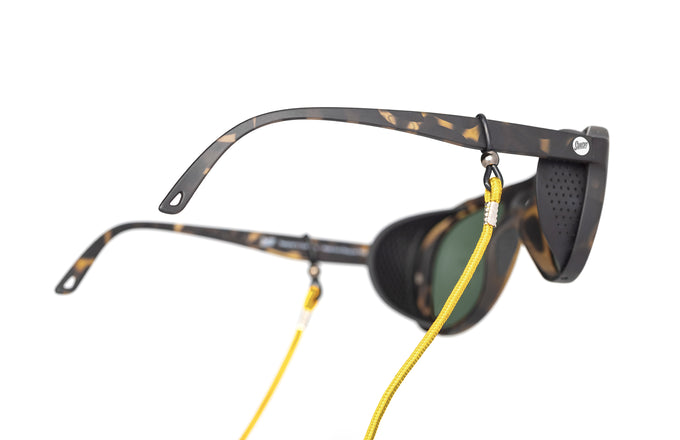 sunski sunglasses retainer yellow on a pair of alpine sunglasses