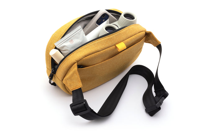 sunski carry sling yellow open with items showing