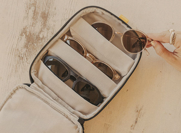sunski travel case open with sunglasses in padded pockets