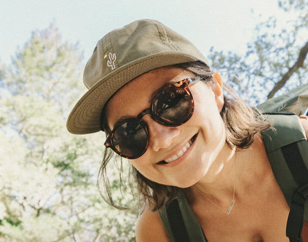 girl looking down at camera wearing sunski friendly cactus hat