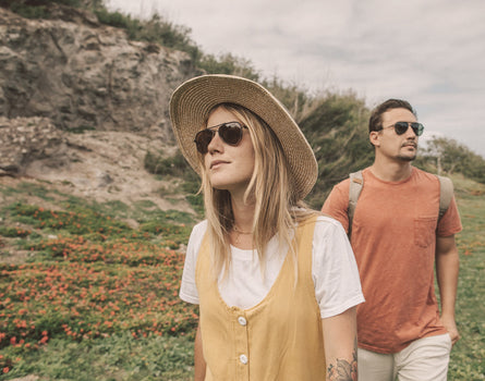 guy and girl wandering wearing sunski astra sunglasses