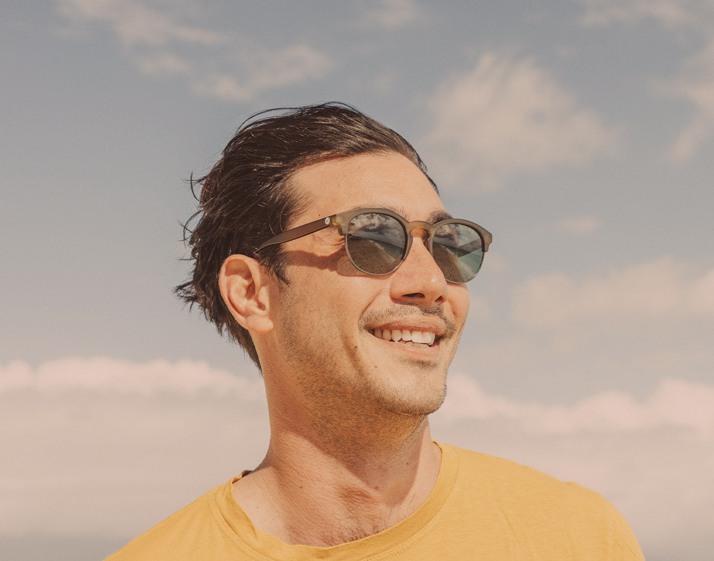 guy in the wind wearing sunski avila sunglasses