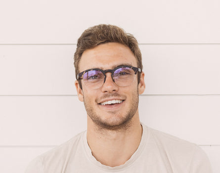 guy smiling wearing sunski avila bluelight glasses