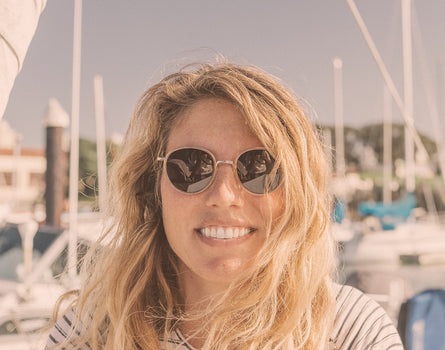 girl smiling wearing sunski baia sunglasses 