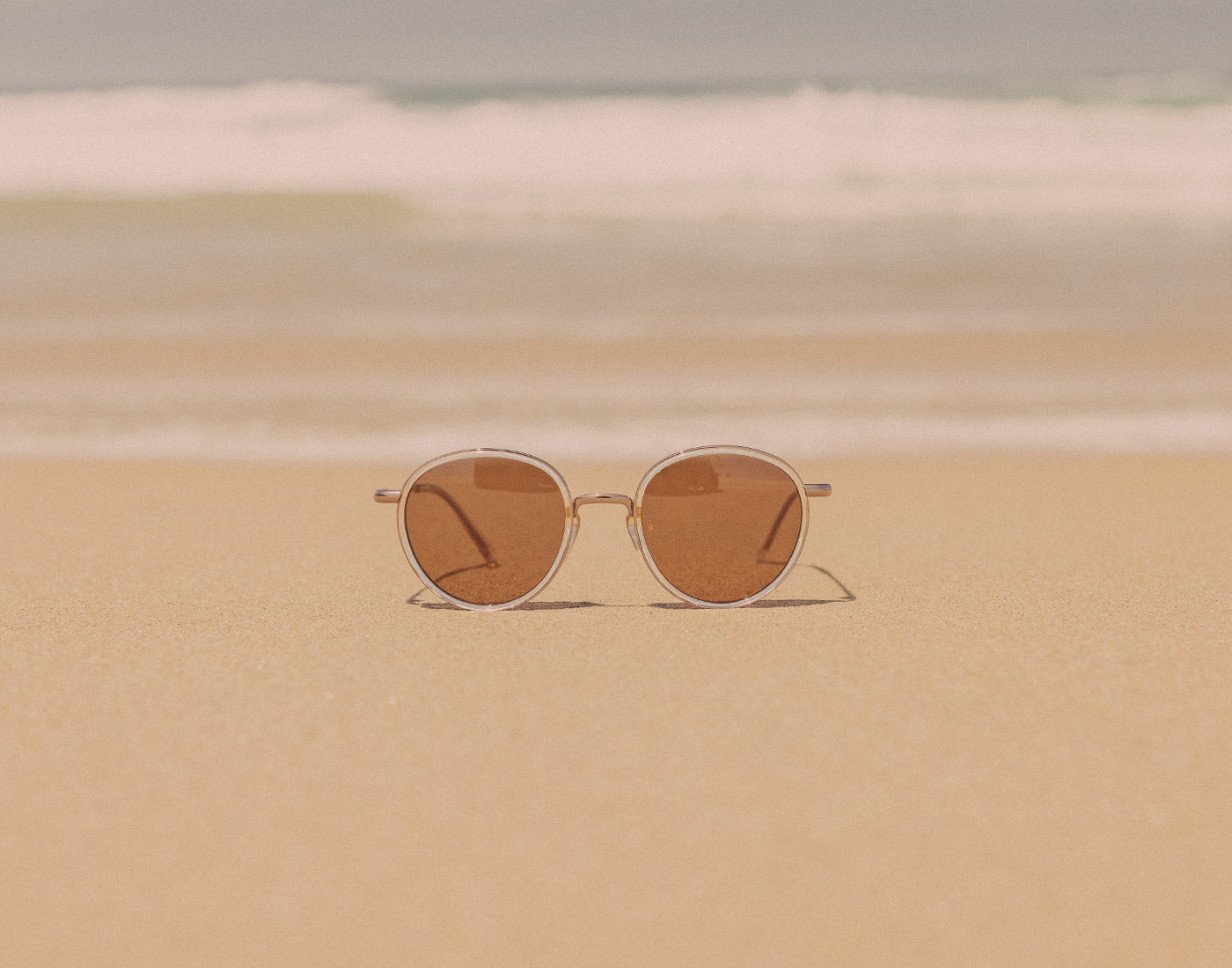 sunski baia sunglasses on the sand