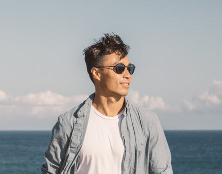 guy standing in the wind wearing sunski bernina sunglasses