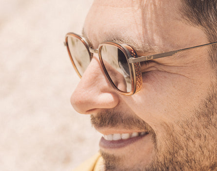 close up profile of guy wearing sunski bernina sunglasses
