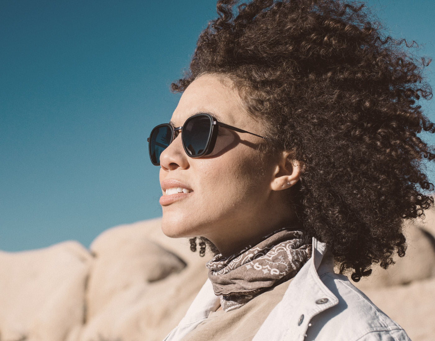 profile of girl wearing sunski bernina sunglasses