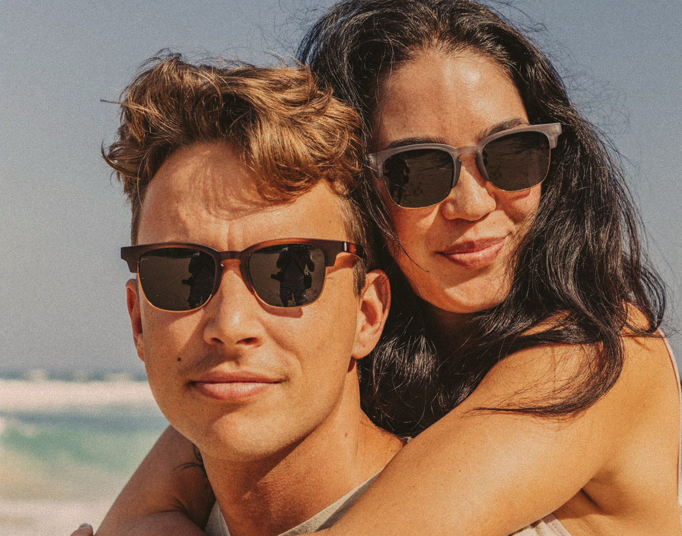 man and woman wearing sunski cambria sunglasses