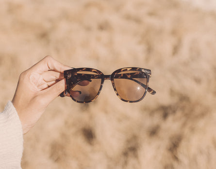 hand holding sunski camina sunglasses